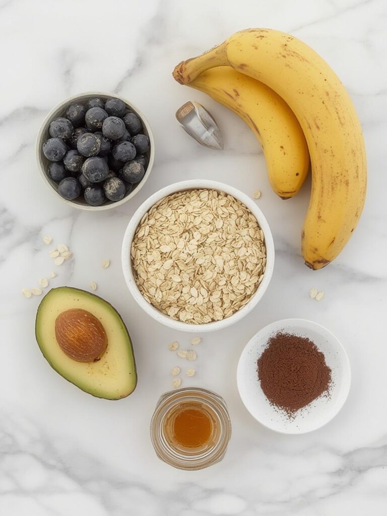 Raw ingredients for healthy baking including avocados, oats, and blueberries.